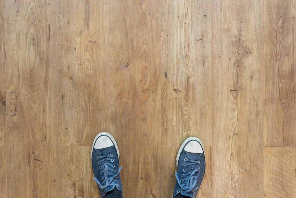 Person standing on newly installed vinyl plank flooring
